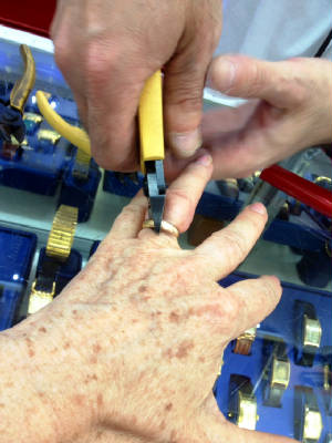 Ring being cut off closeup.JPG